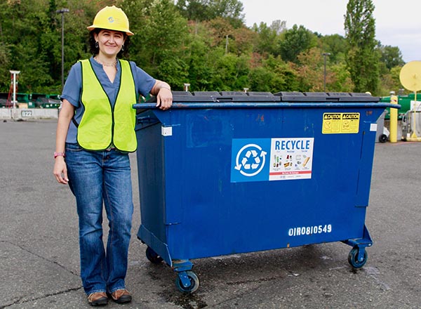Professional cleaning a dumpster